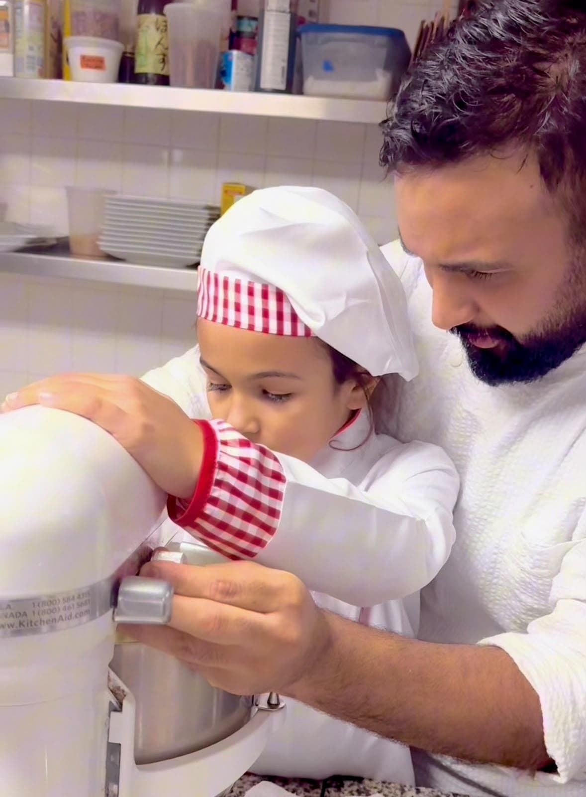 Abdellah baking together with his daughter
