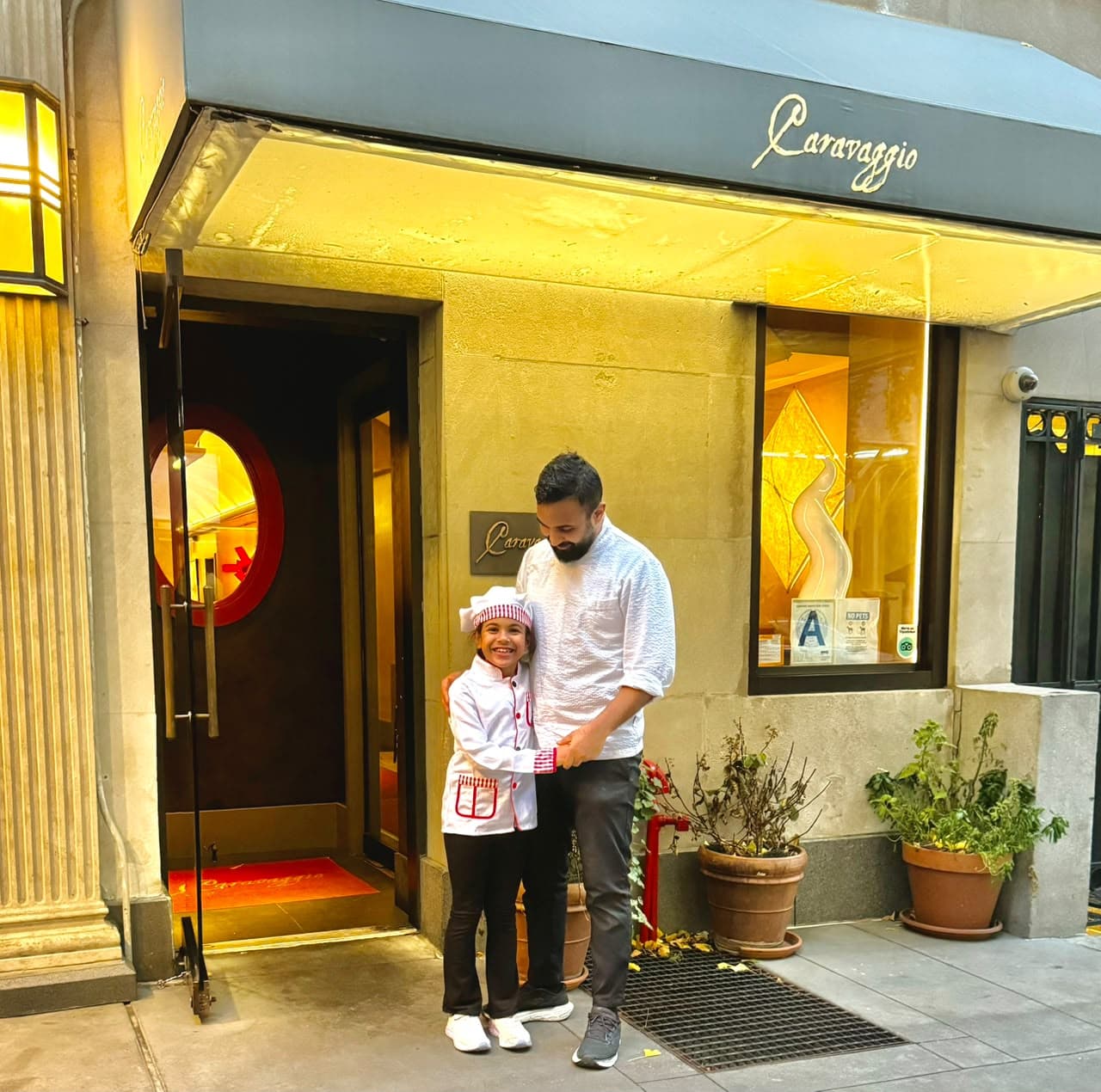 Abdellah and his daughter outside a New York bakery